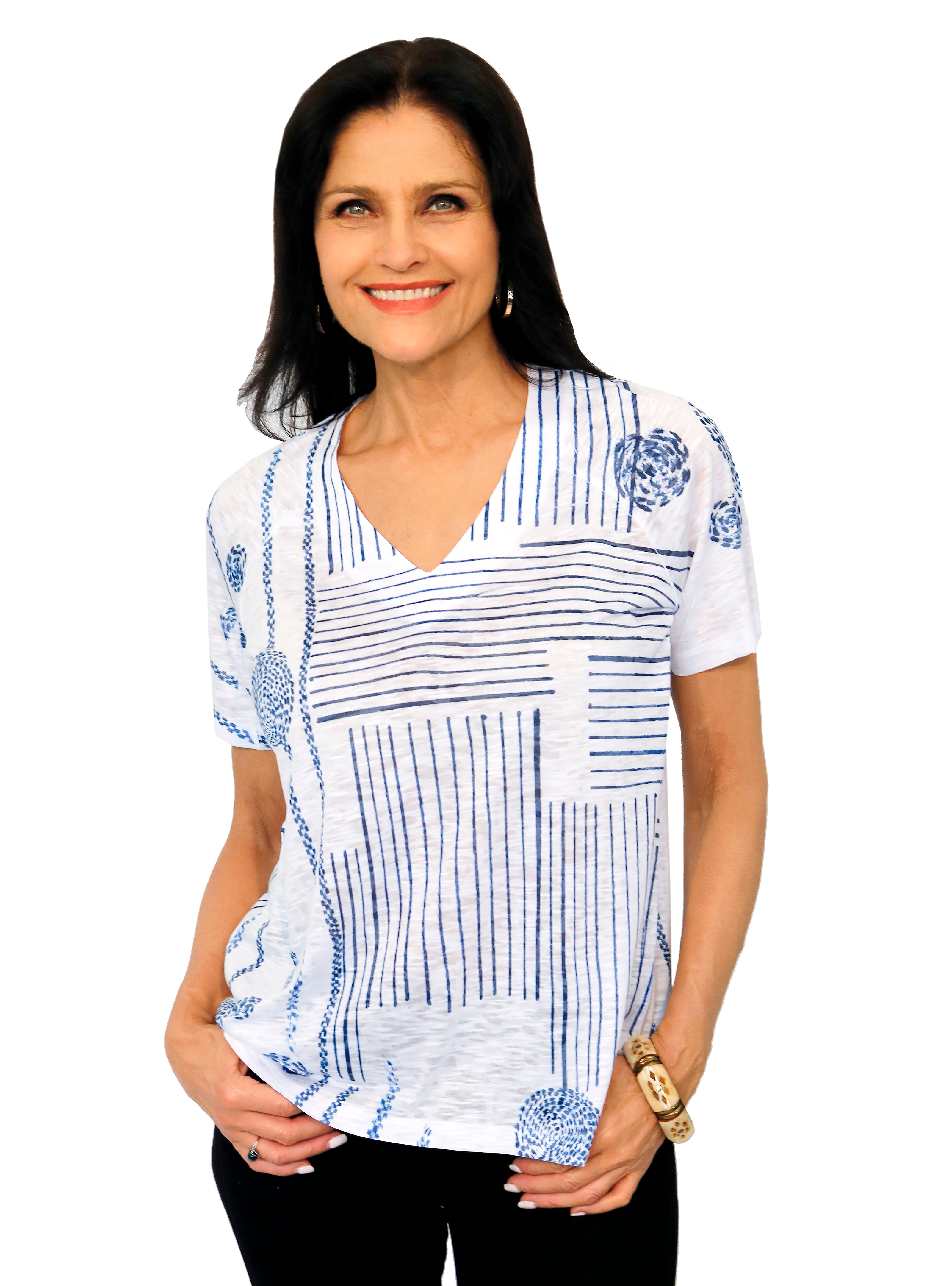 Impulse California Women's Dandelions Short Sleeve Top made out of 50% rayon and 50% polyester that is lightweight and soft. Features a V-neckline and imprinted with a dark blue artistic design that resembles dandelions. Relaxed fit. Made in the USA