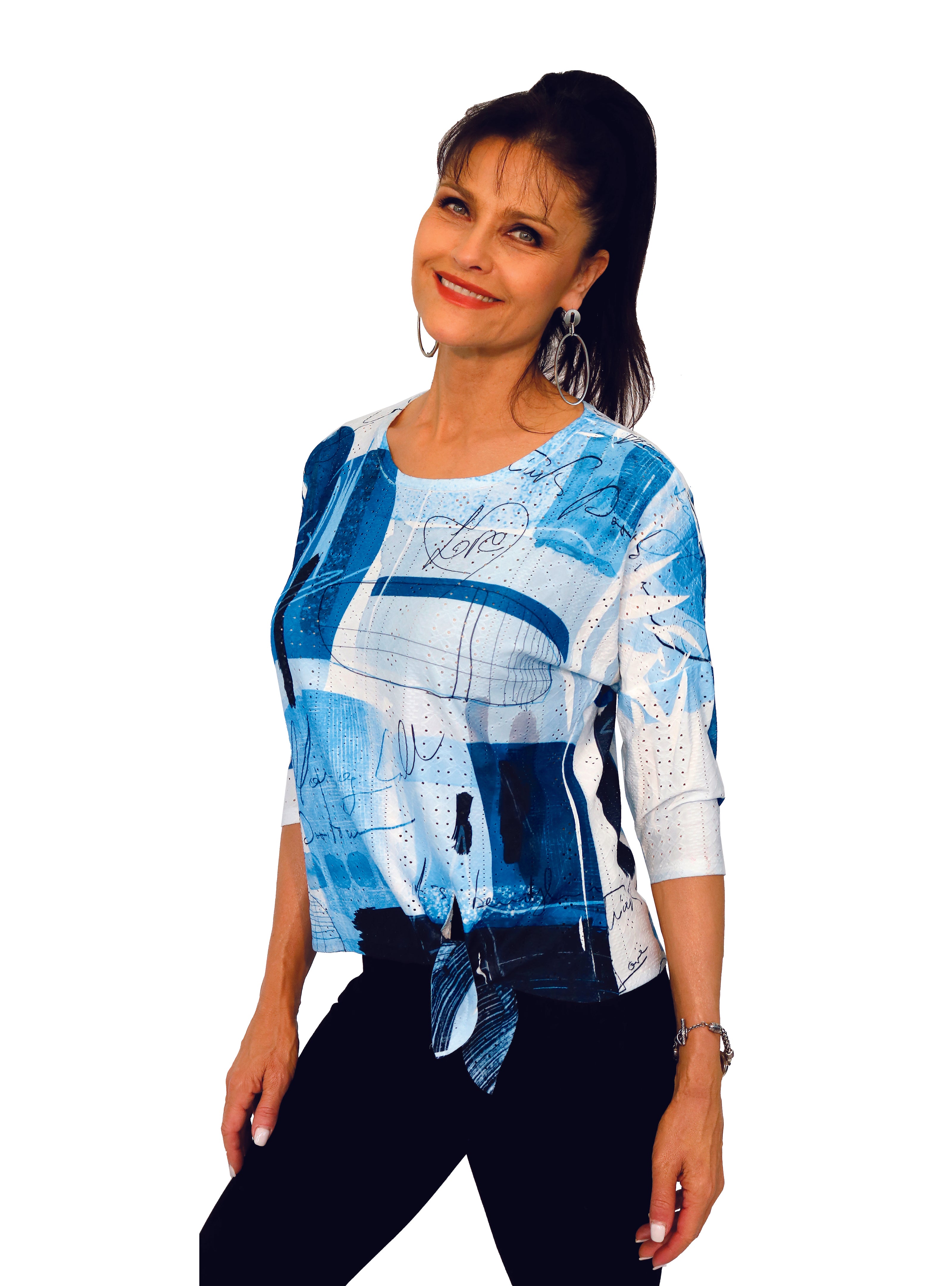 Impulse California women's drop shoulder top imprinted with varying hues of blue. Tie front detail on the hemline. Made in USA.