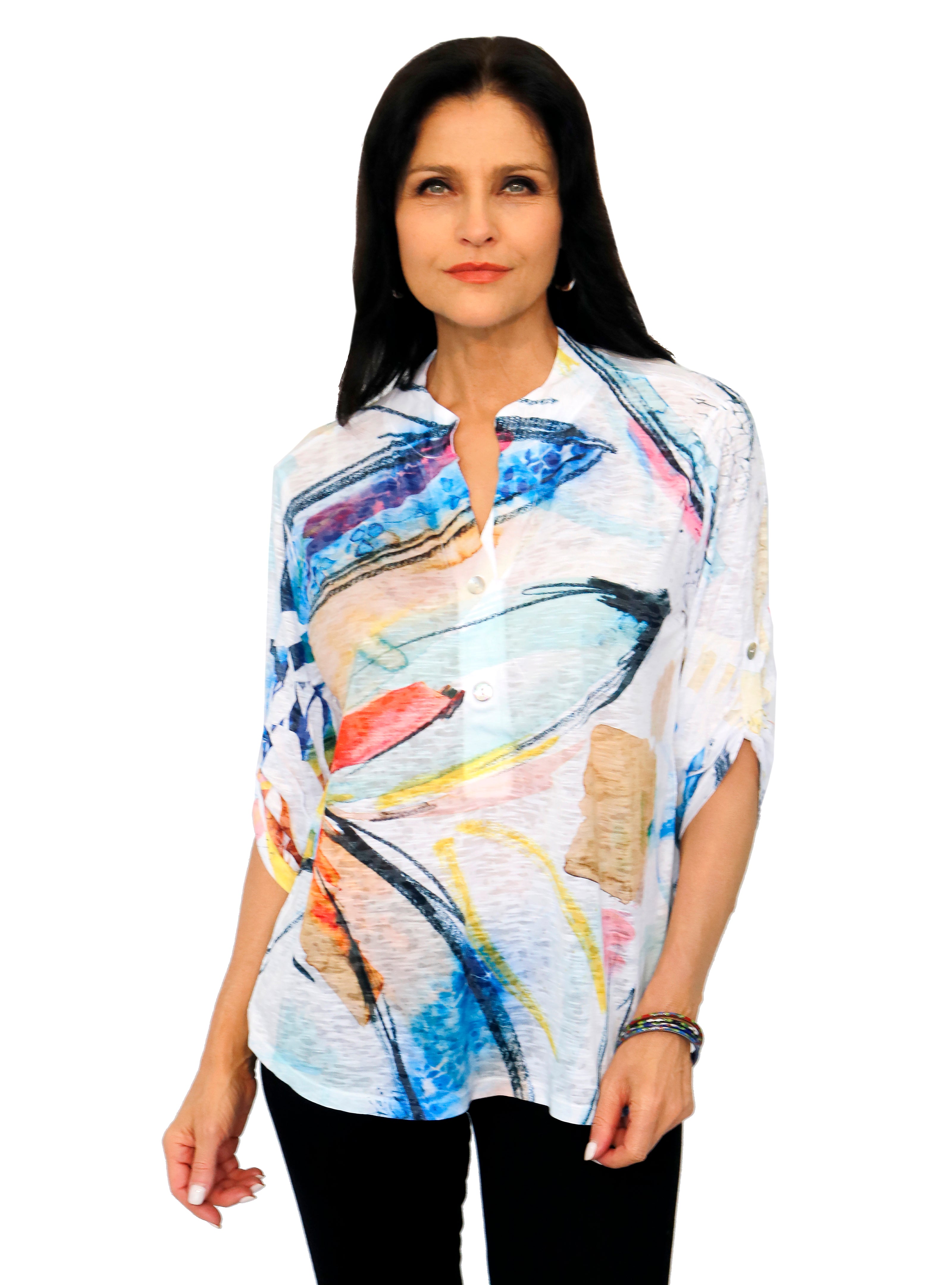 Impulse California Women's top featuring 3/4 sleeves with a tab and button, and mandarin collar V-neck. Imprinted with a colorful design. Made in the USA.